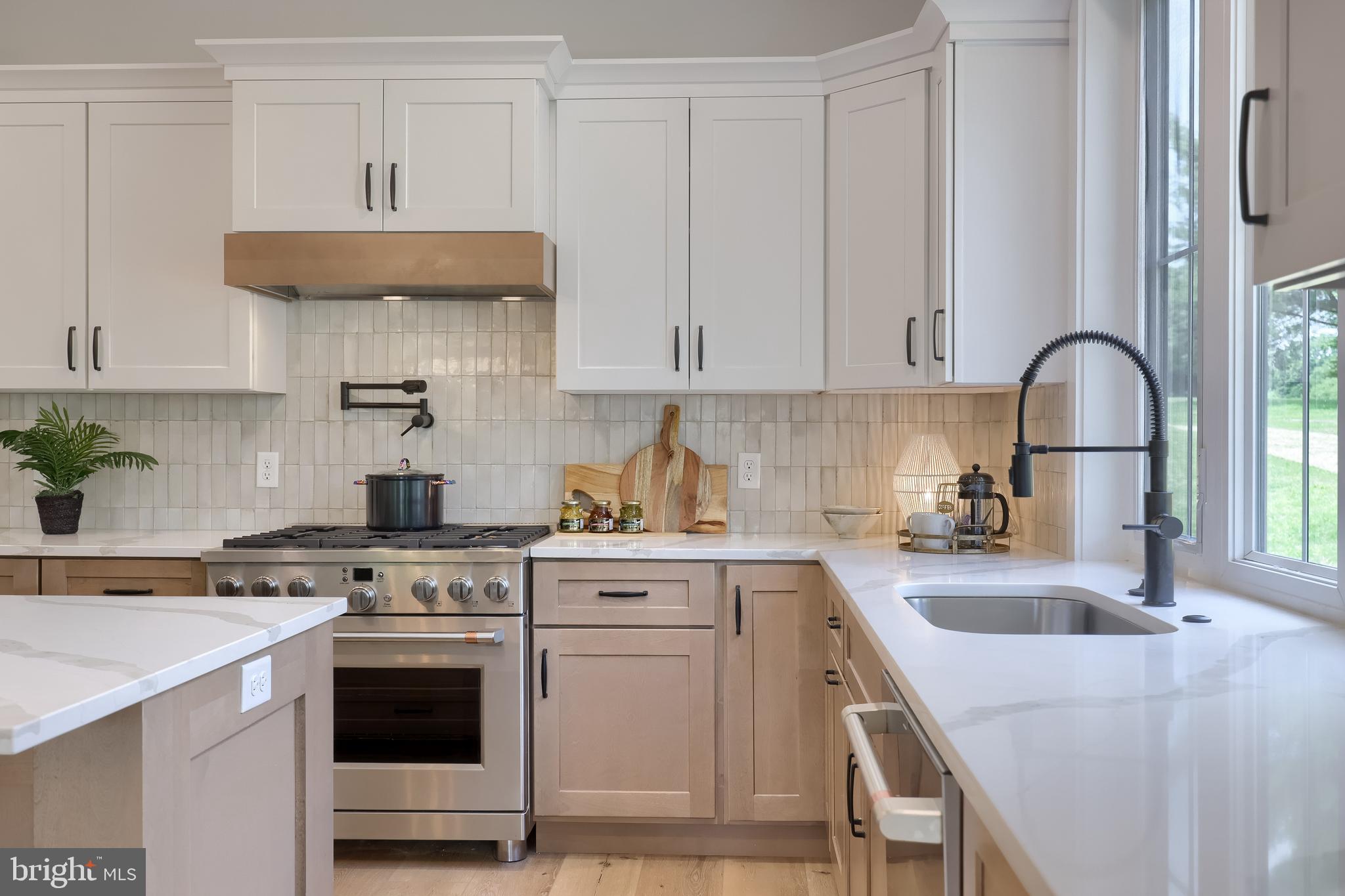 136 Stillcreek Road Millersville, PA 17551 - Photo 35 of 72 a kitchen with stainless steel appliances granite countertop a sink stove and white cabinets