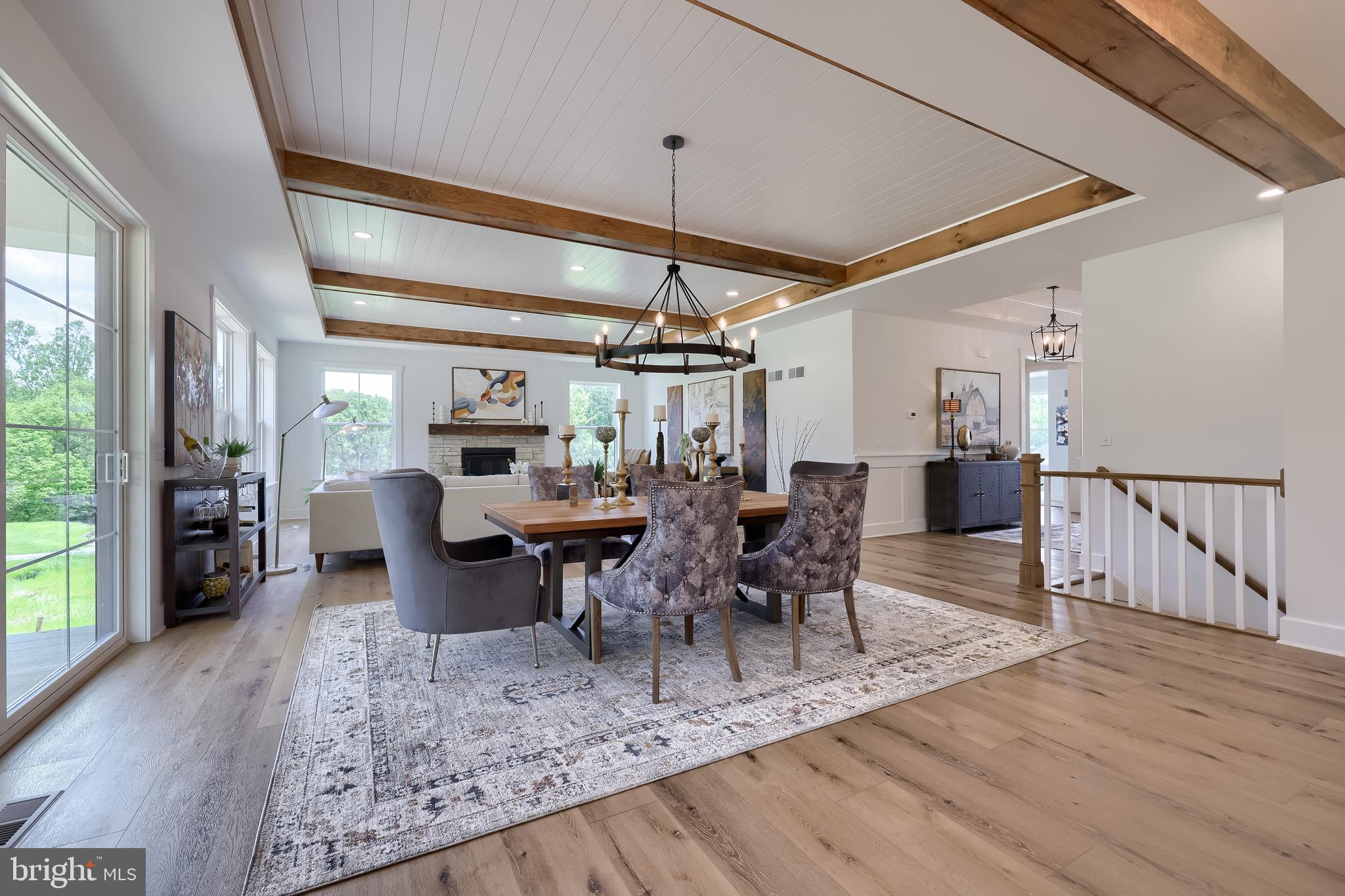 136 Stillcreek Road Millersville, PA 17551 - Photo 38 of 72 a view of a dining room and livingroom with furniture wooden floor a chandelier