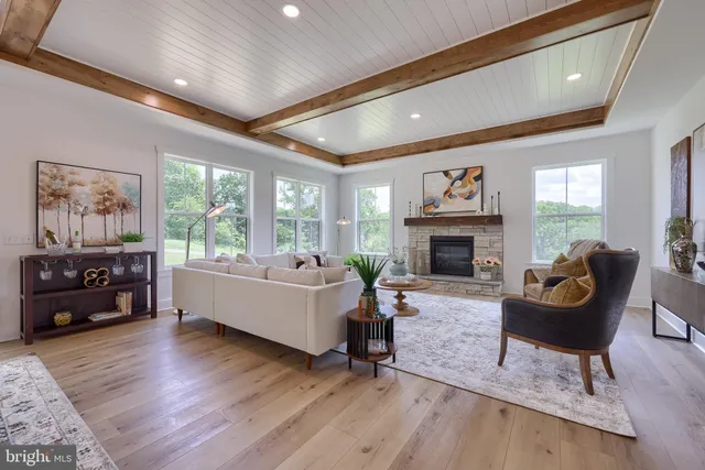 an aerial view of a house with a yard and lake view