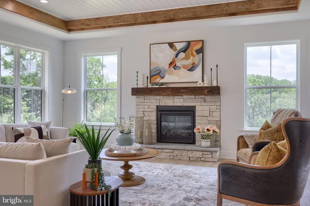 an aerial view of a house with a garden and lake view