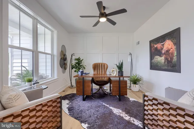 a view of a room with furniture and a potted plant