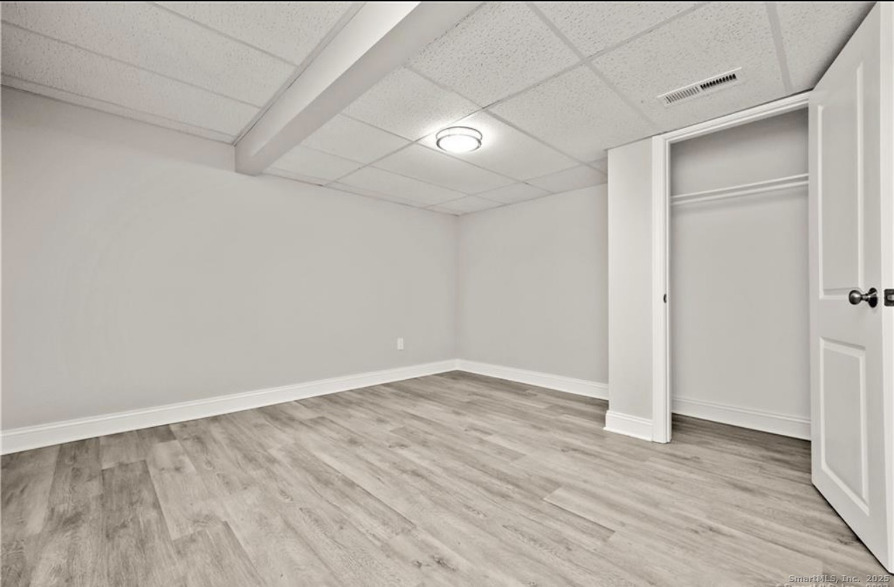 383 Sequoia Lane, Unit A Stratford, CT 06614 - Photo 14 of 17 wooden floor in an empty room