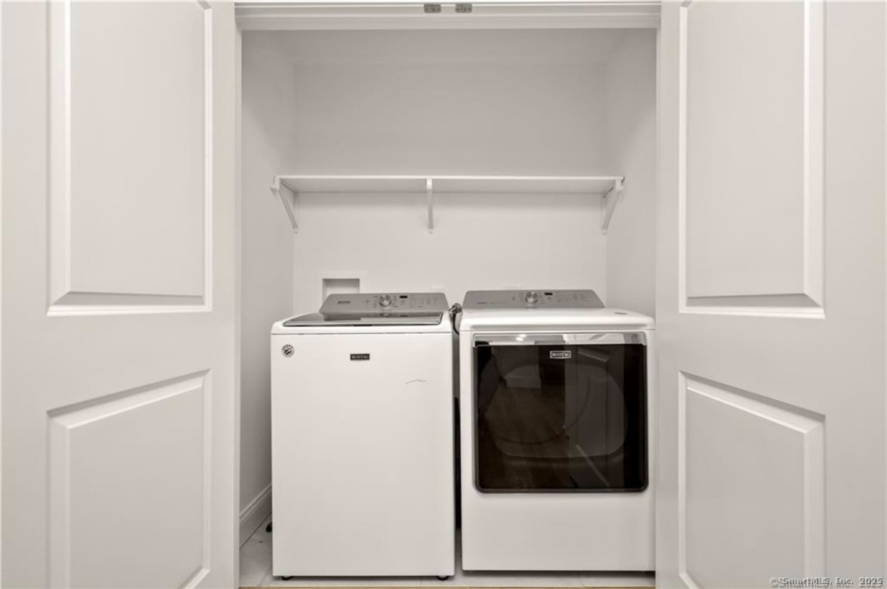 383 Sequoia Lane, Unit A Stratford, CT 06614 - Photo 9 of 17 a utility room with dryer and washer