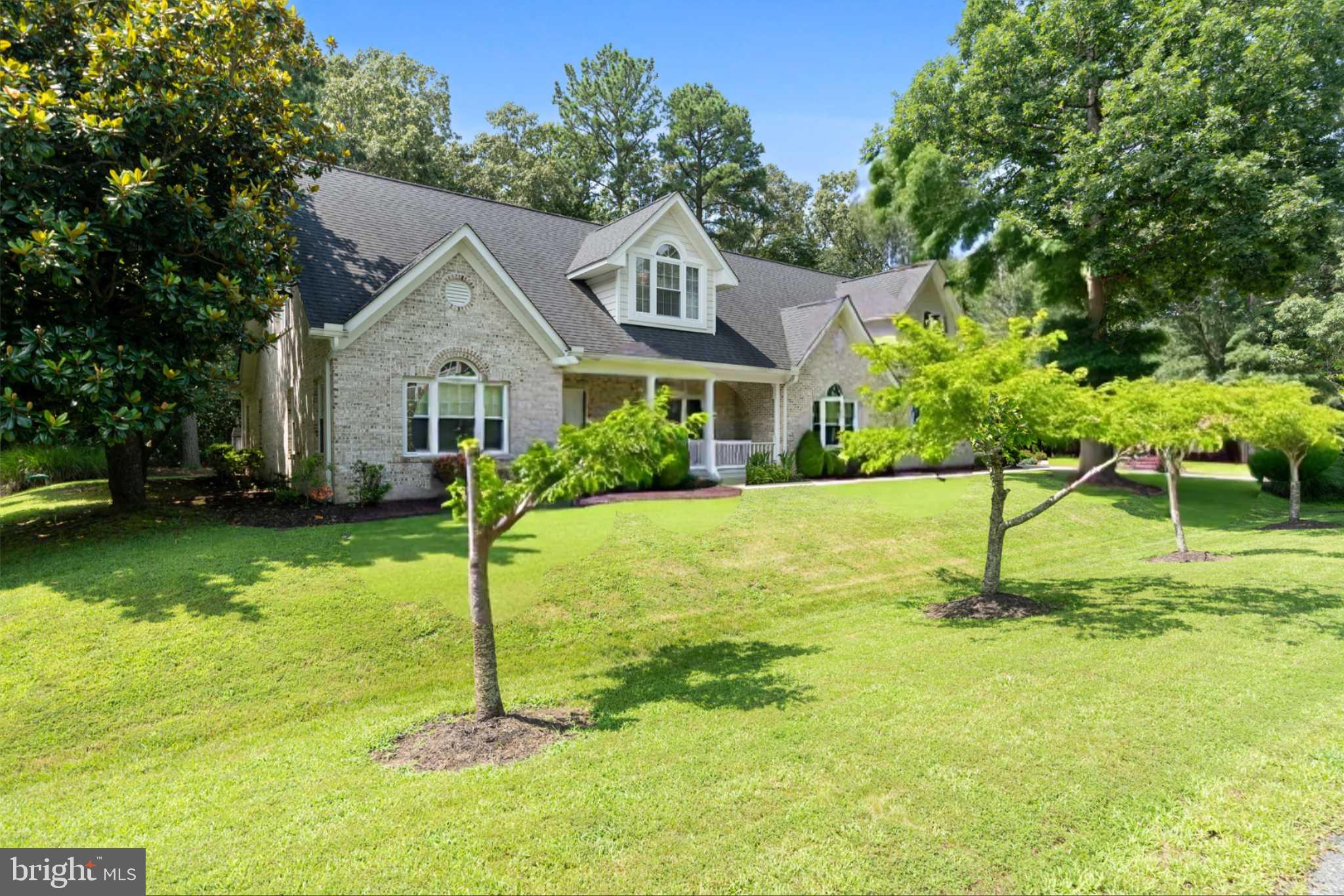 a house that has a tree in front of the house