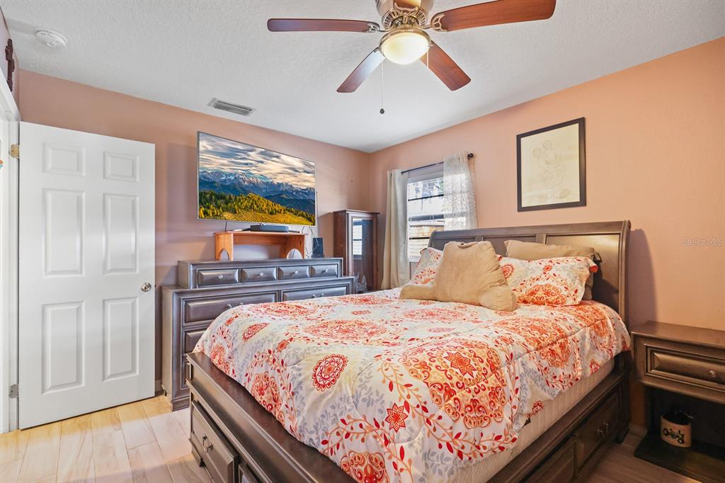 1001 Alpine Drive Brandon, FL 33510 - Photo 12 of 29 a bed sitting in a bedroom next to a window