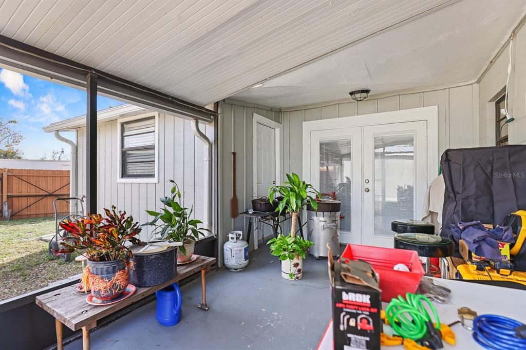 1001 Alpine Drive Brandon, FL 33510 - Photo 23 of 29 a living room filled with furniture and a potted plant