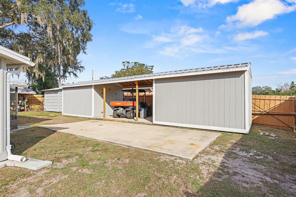 1001 Alpine Drive Brandon, FL 33510 - Photo 25 of 29 a view of a house with a snow in the yard