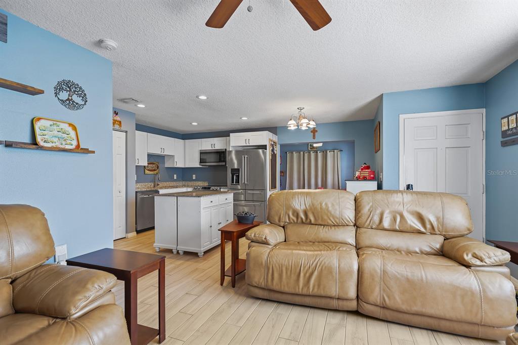 1001 Alpine Drive Brandon, FL 33510 - Photo 6 of 29 a living room with furniture and kitchen view