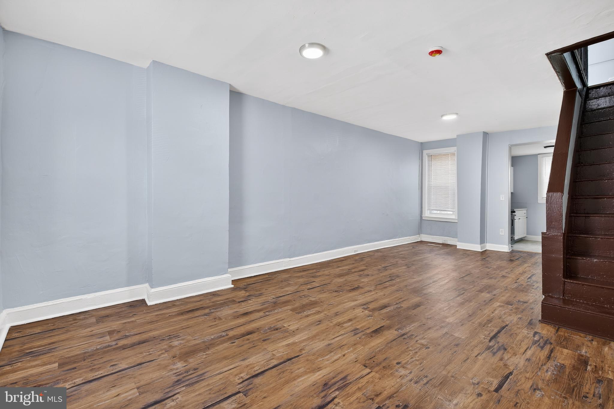 3039 Gransback Street Philadelphia, PA 19134 - Photo 4 of 10 a view of an empty room with wooden floor and a window