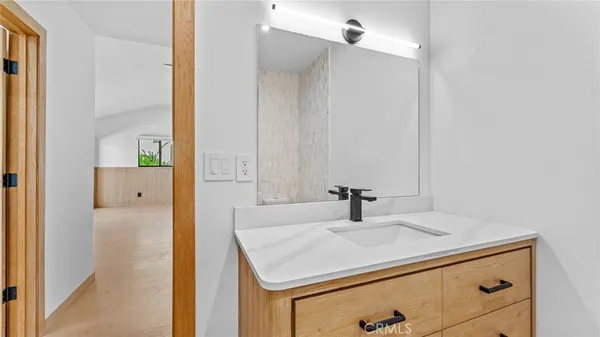 a bathroom with a sink and a mirror