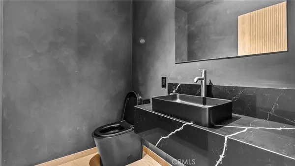a room with a sink and a stove