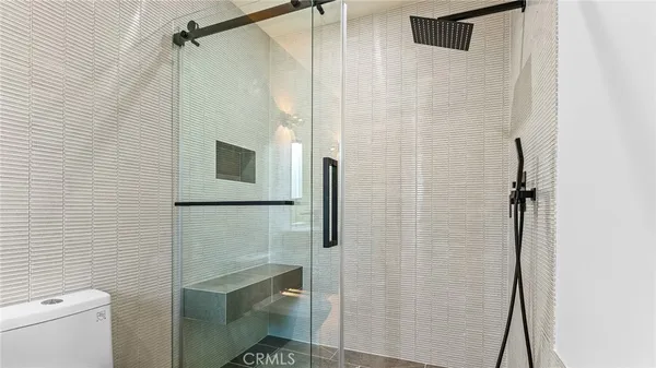 a view of an empty room with painting on the wall
