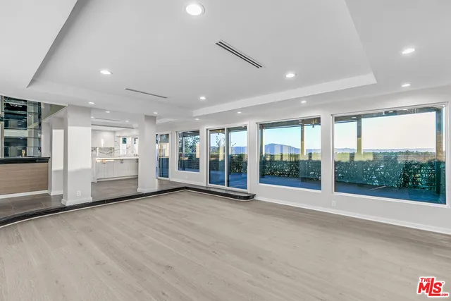a view of a porch with wooden floor and outdoor space