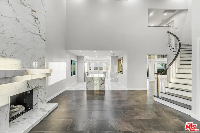 a view of a living room and entryway