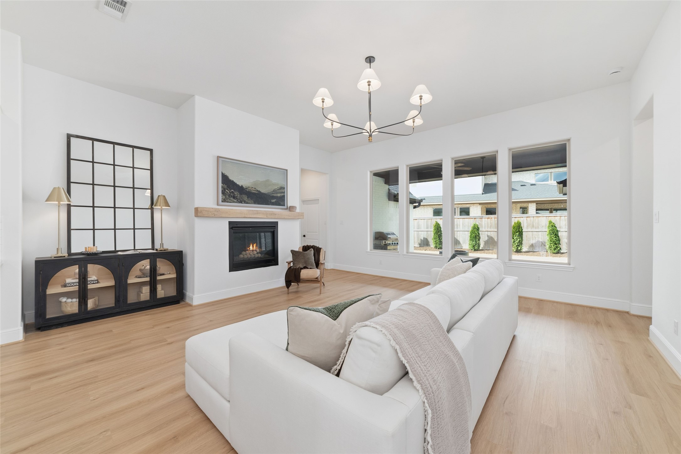 15208 Tree Swallow Court Magnolia, TX 77354 - Photo 12 of 50 a living room with furniture a fireplace and a flat screen tv