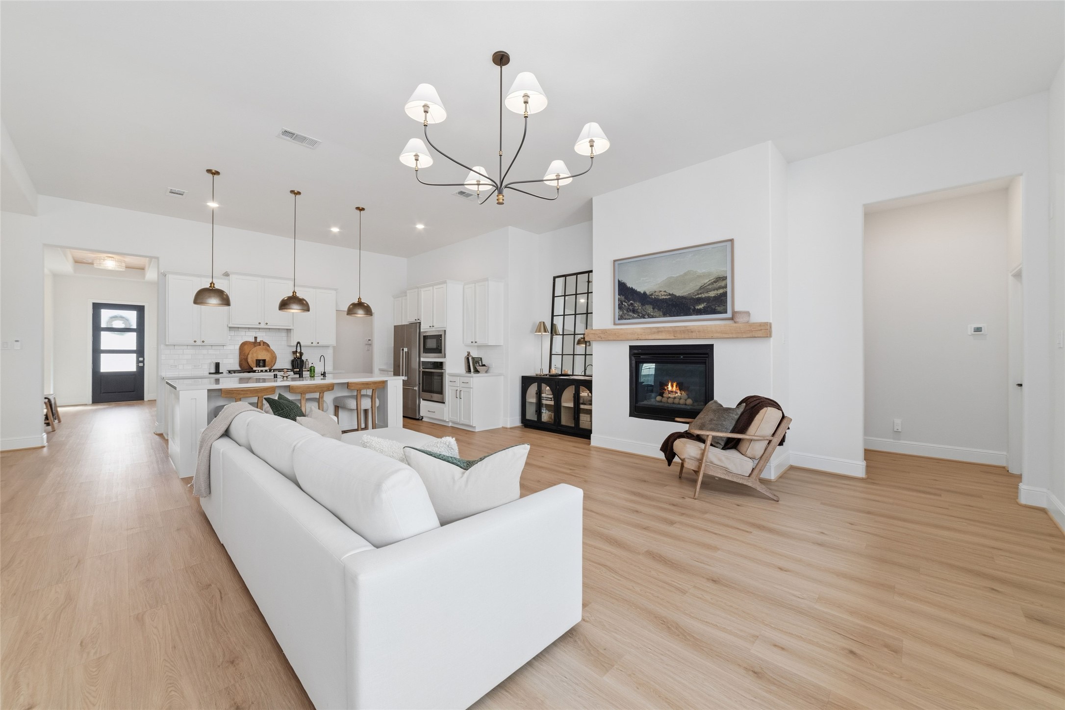 15208 Tree Swallow Court Magnolia, TX 77354 - Photo 14 of 50 a living room with furniture a fireplace and a flat screen tv
