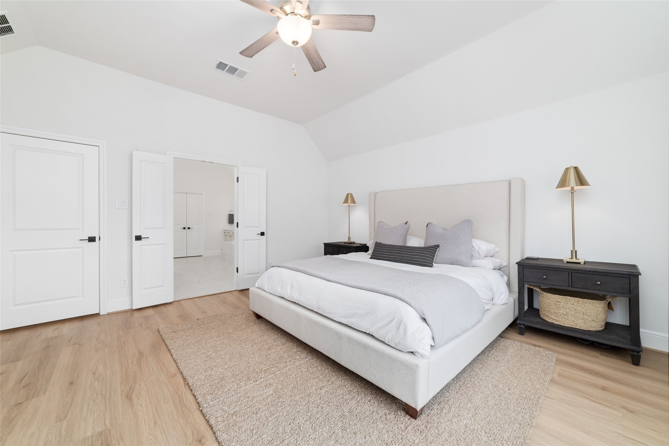 15208 Tree Swallow Court Magnolia, TX 77354 - Photo 15 of 50 a bedroom with a bed and a chandelier