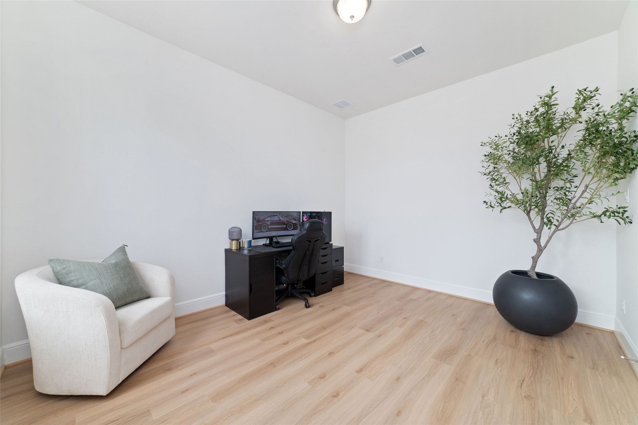 15208 Tree Swallow Court Magnolia, TX 77354 - Photo 21 of 50 a living room with furniture and a potted plant