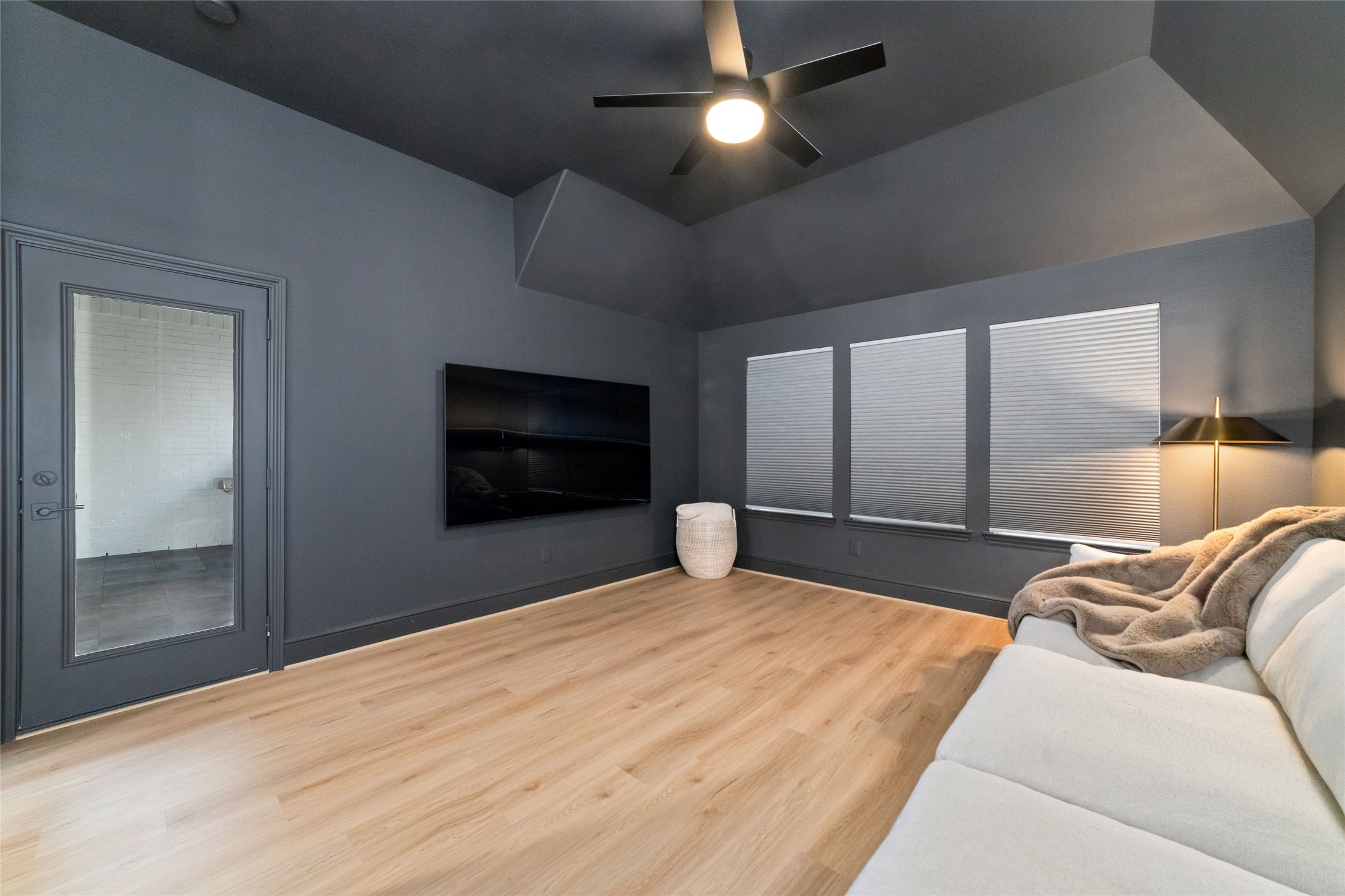 15208 Tree Swallow Court Magnolia, TX 77354 - Photo 22 of 50 a bedroom with a bed and a flat tv screen