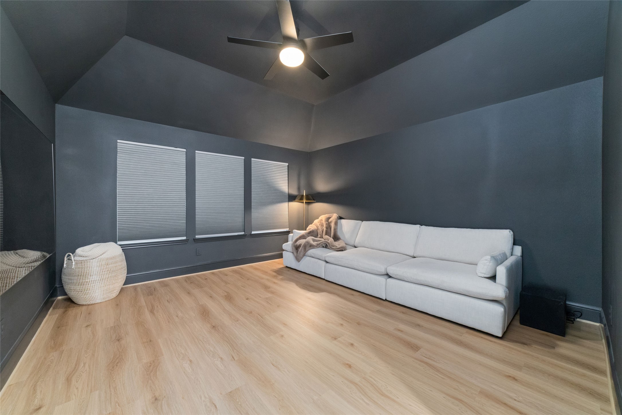 15208 Tree Swallow Court Magnolia, TX 77354 - Photo 24 of 50 a living room with furniture and a wooden floor