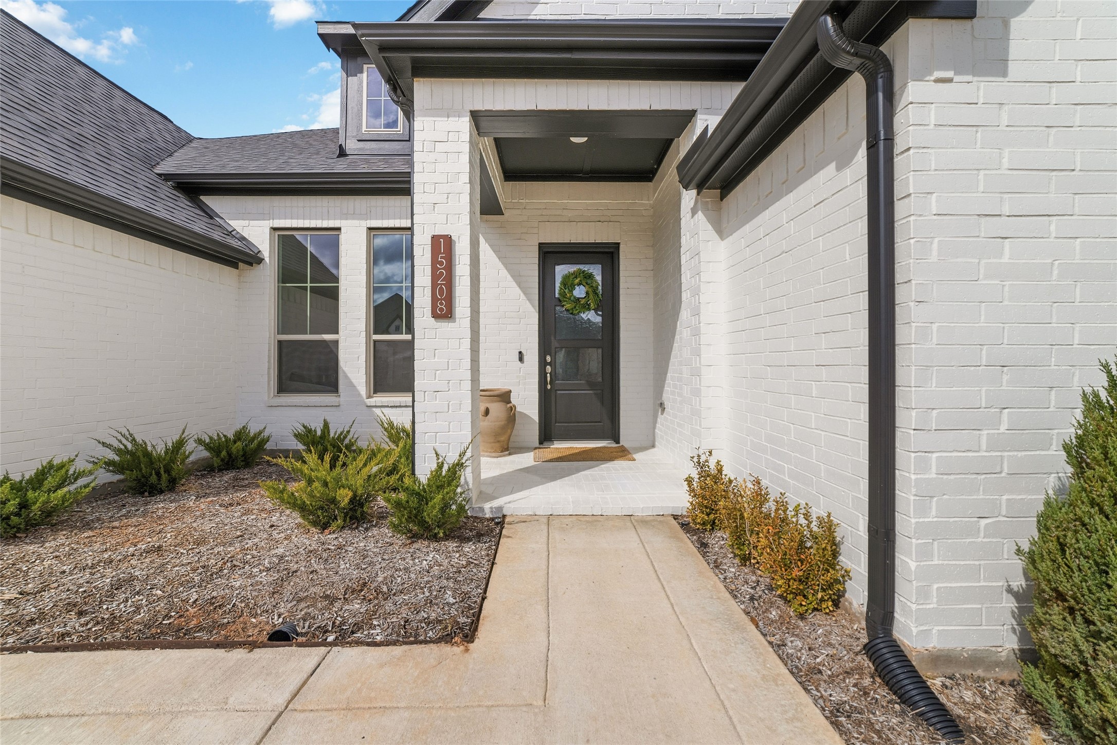 15208 Tree Swallow Court Magnolia, TX 77354 - Photo 3 of 50 a entryway with flower pots