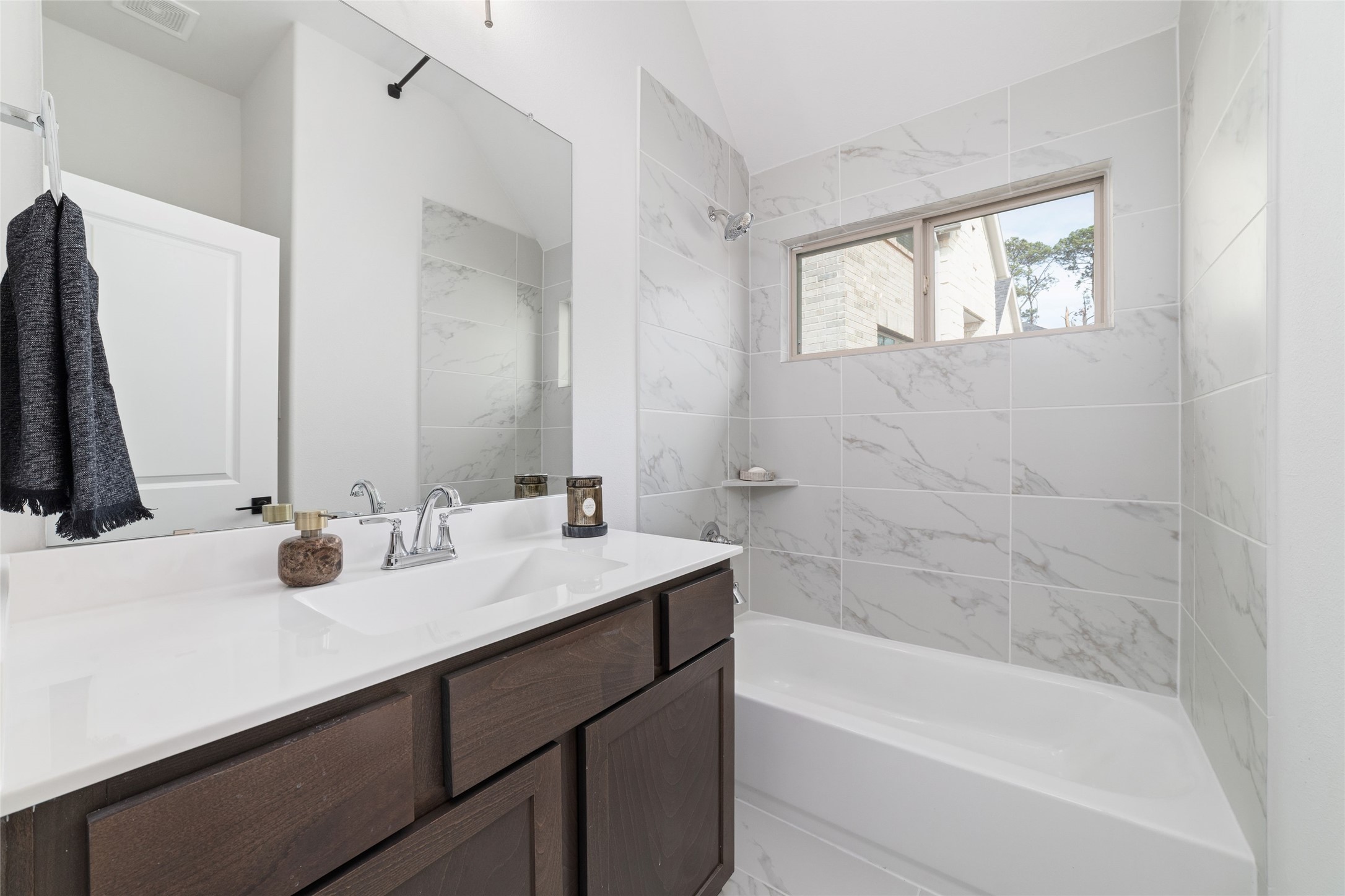 15208 Tree Swallow Court Magnolia, TX 77354 - Photo 31 of 50 a bathroom with a bathtub sink and mirror