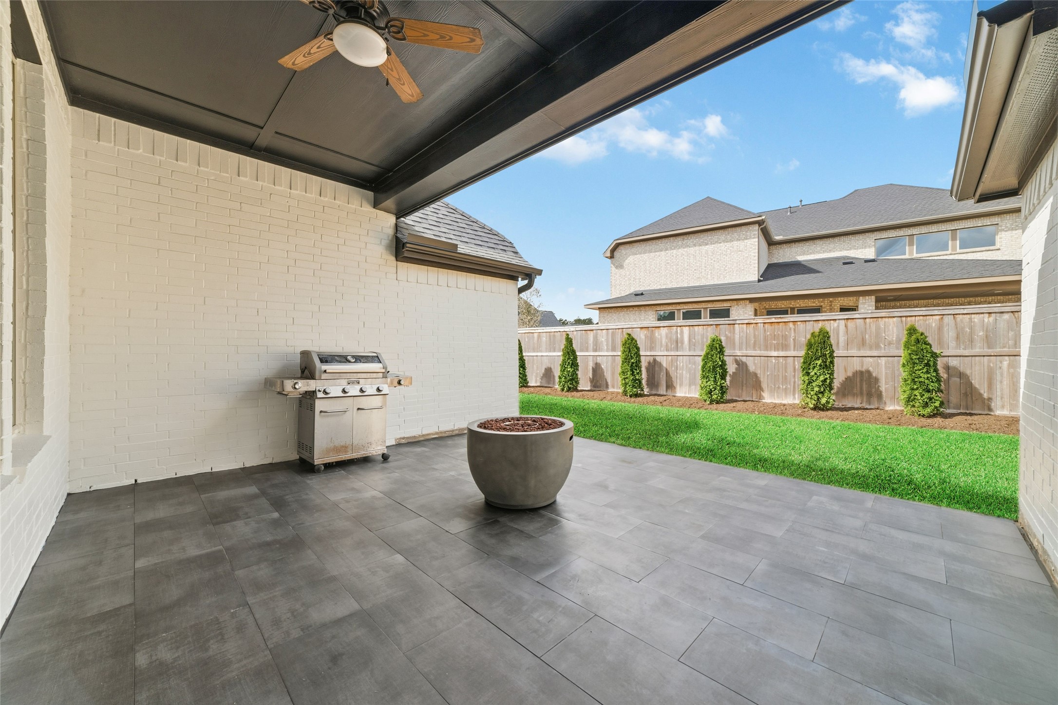15208 Tree Swallow Court Magnolia, TX 77354 - Photo 32 of 50 a view of a patio with a chairs and table