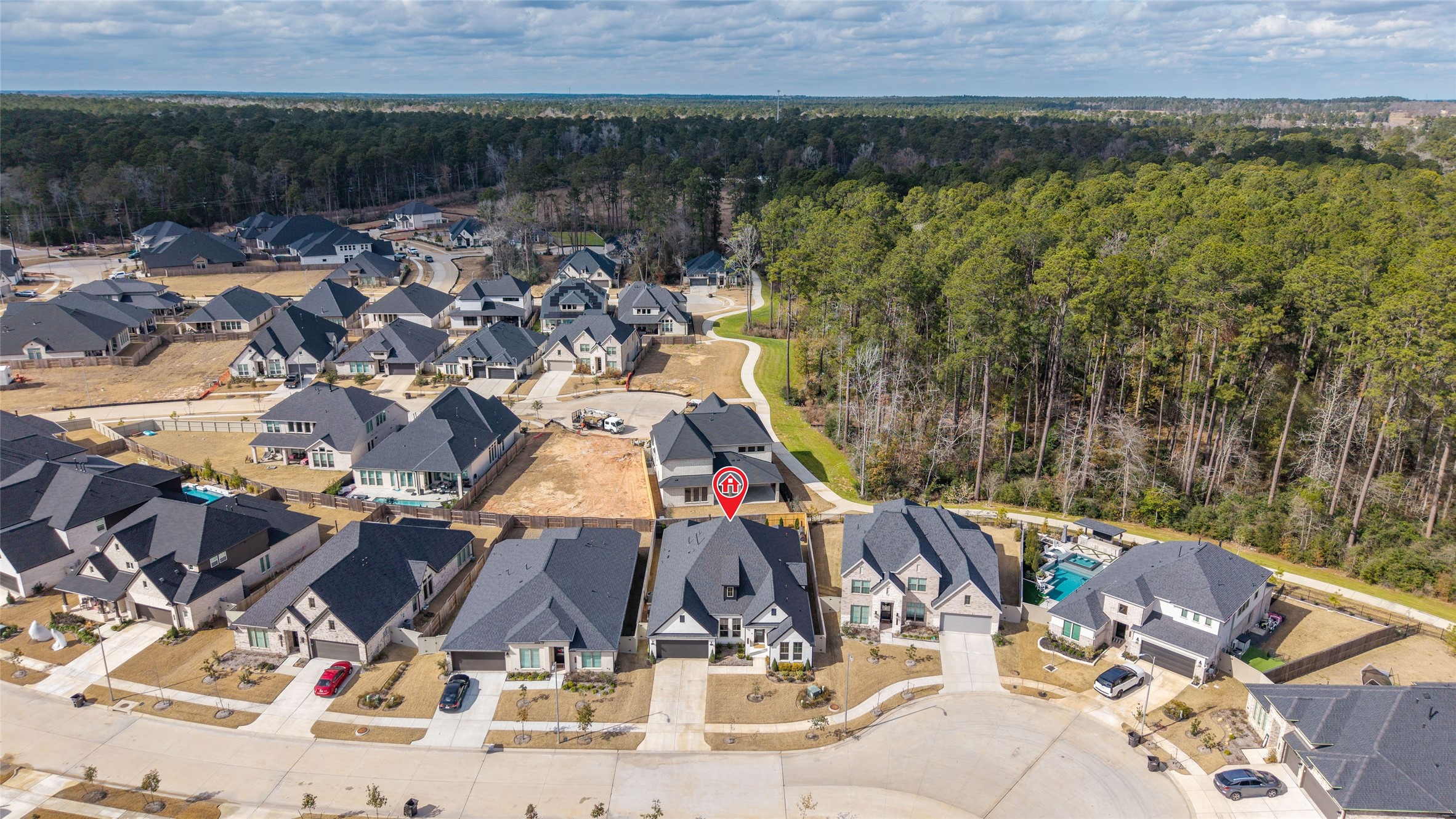 15208 Tree Swallow Court Magnolia, TX 77354 - Photo 41 of 50 an aerial view of a house with a yard and lake view