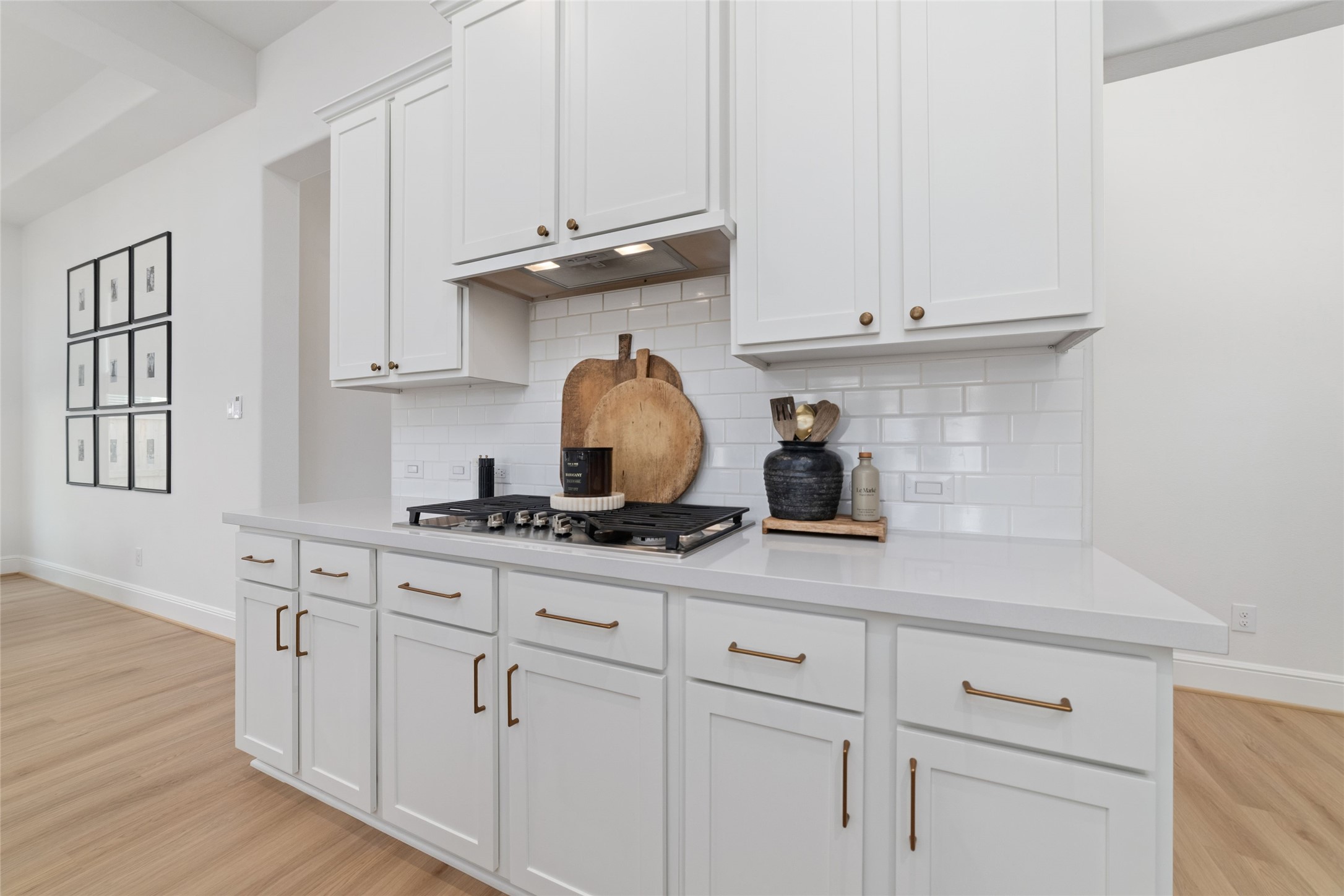 15208 Tree Swallow Court Magnolia, TX 77354 - Photo 6 of 50 a kitchen with white cabinets and a stove