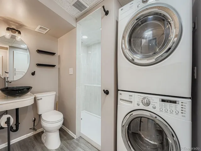 a view of bathroom with a toilet and a sink