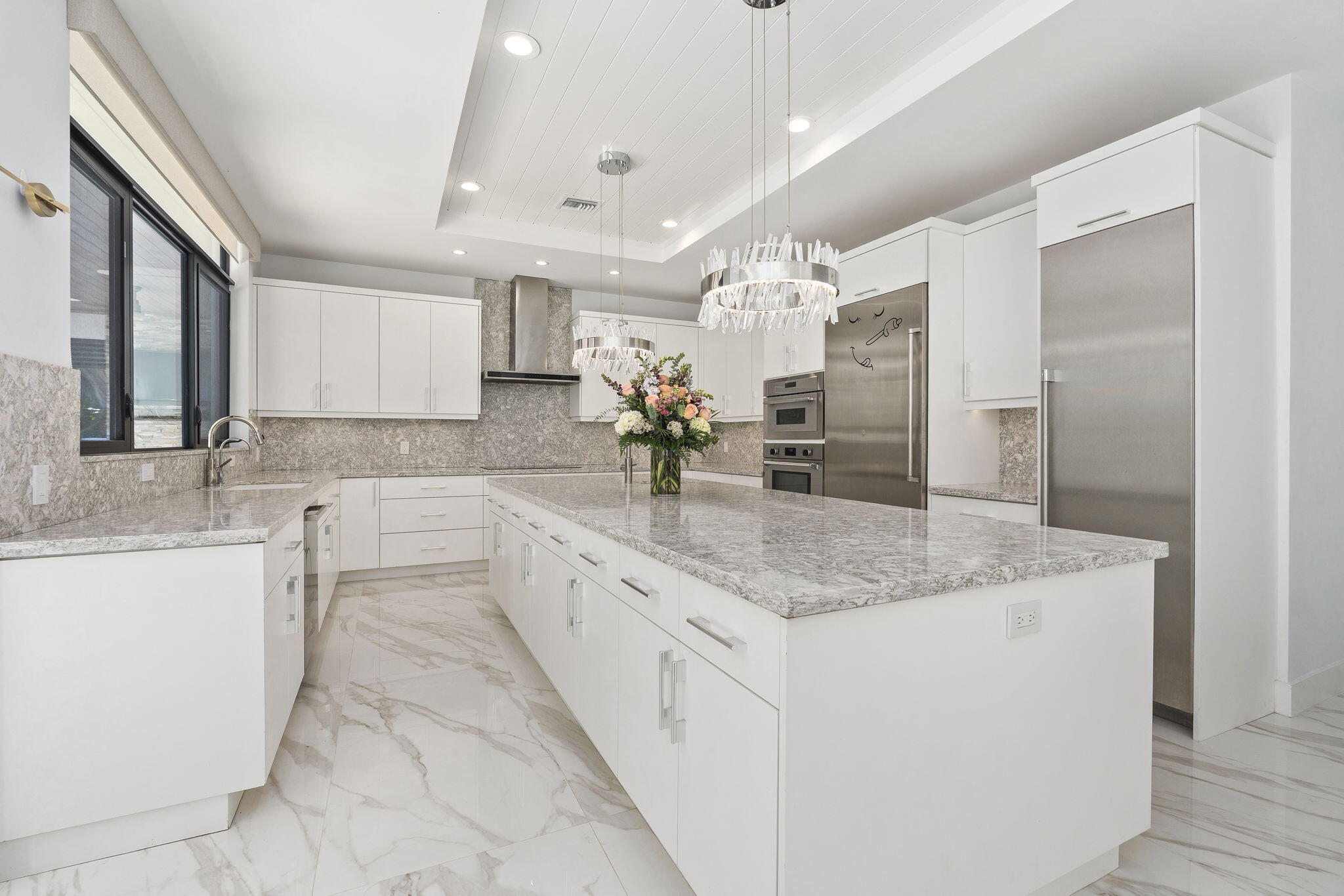 742 Marble Court Boca Raton, FL 33432 - Photo 20 of 95 a bathroom with a granite countertop sink a large mirror and a shower