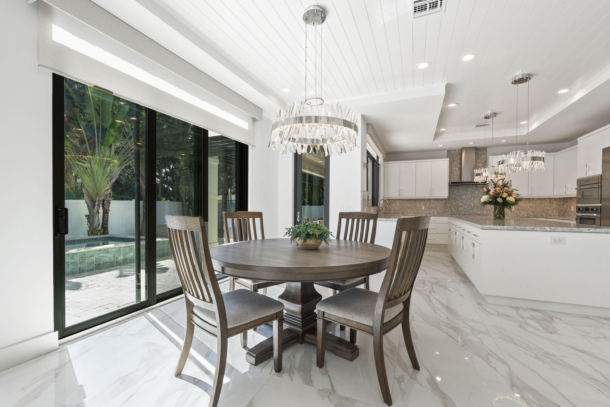 742 Marble Court Boca Raton, FL 33432 - Photo 22 of 95 a view of a dining room with furniture window and wooden floor