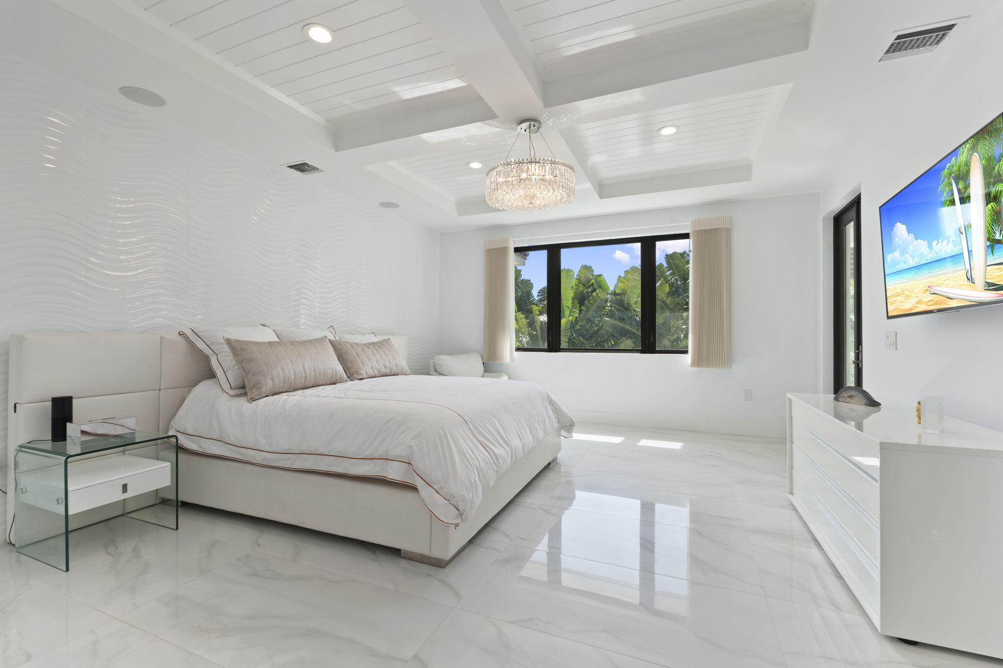 742 Marble Court Boca Raton, FL 33432 - Photo 29 of 95 a bedroom with a large bed and a flat screen tv