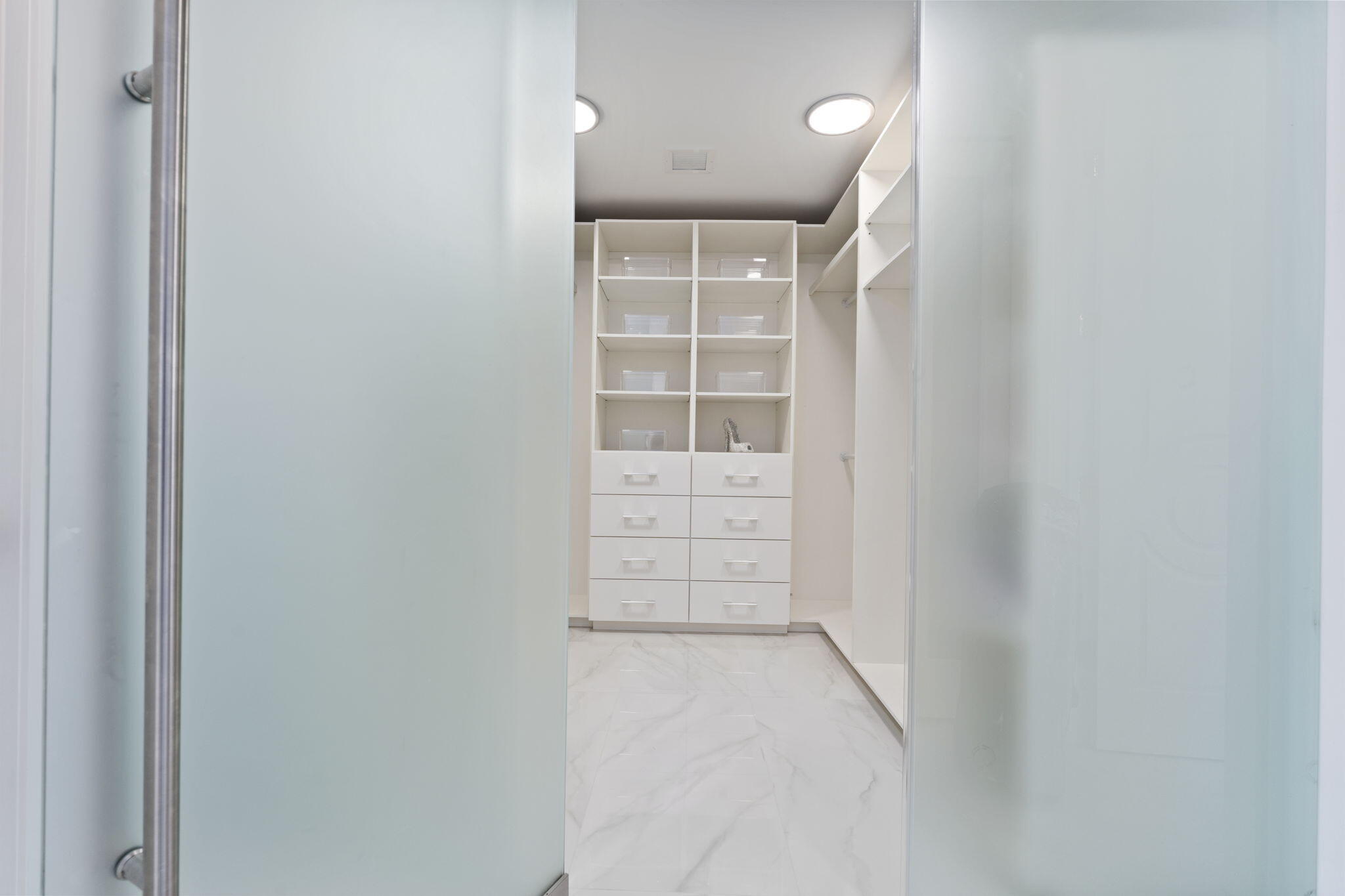 742 Marble Court Boca Raton, FL 33432 - Photo 40 of 95 a view of walk in closet with empty racks