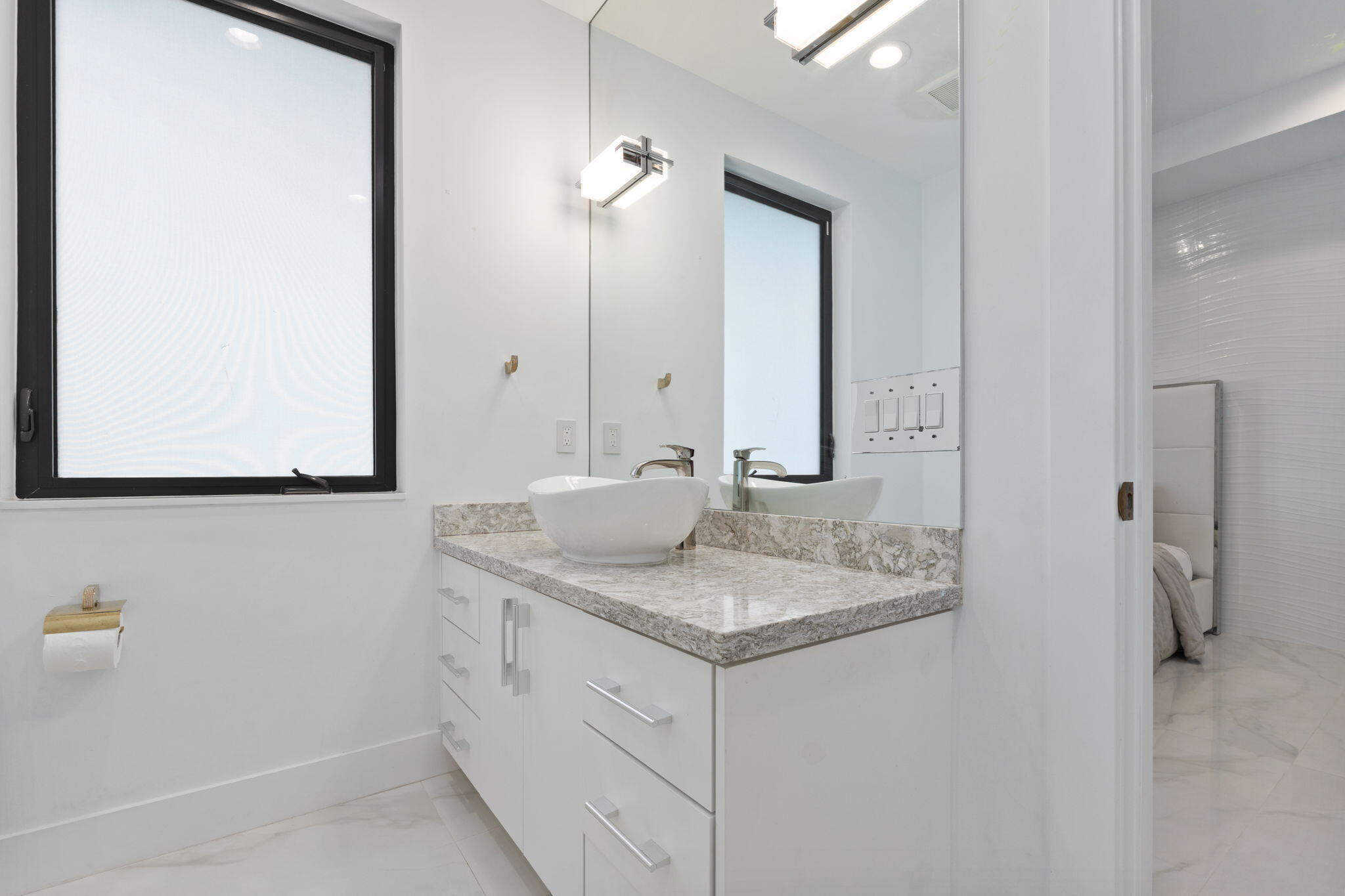 742 Marble Court Boca Raton, FL 33432 - Photo 51 of 95 a bathroom with a sink and a mirror
