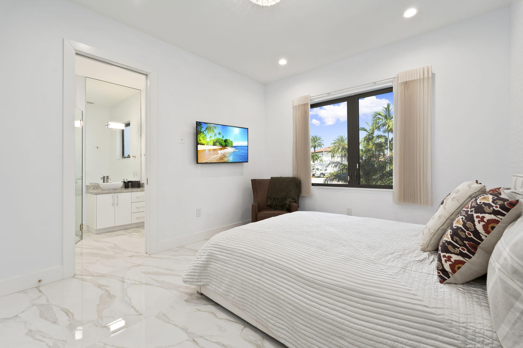 742 Marble Court Boca Raton, FL 33432 - Photo 56 of 95 a bedroom with a bed and a view of bathroom