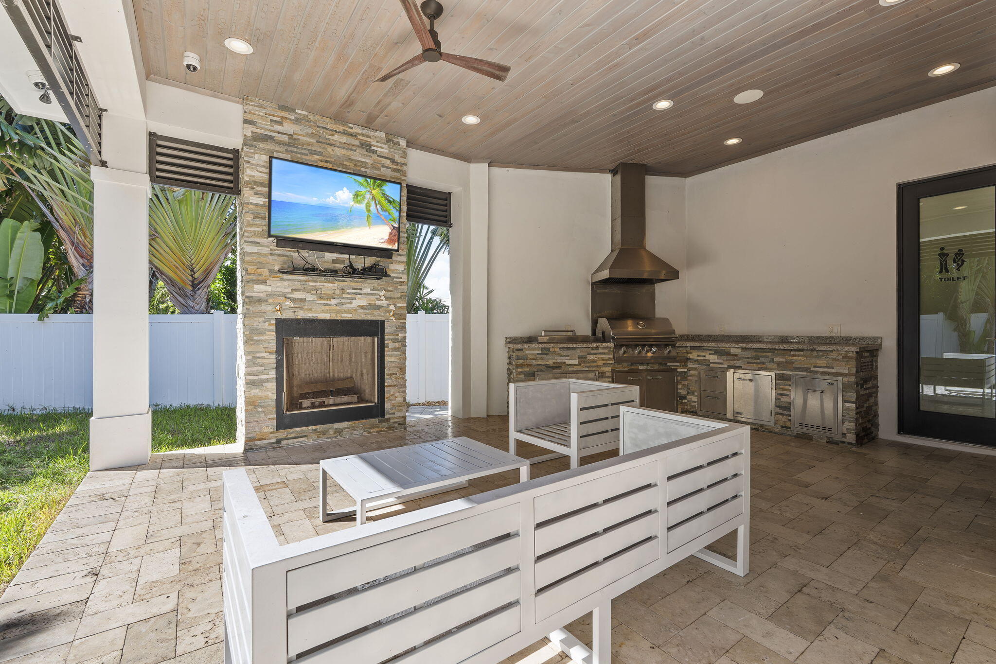742 Marble Court Boca Raton, FL 33432 - Photo 71 of 95 a kitchen with stainless steel appliances kitchen island granite countertop a stove and a sink with granite countertops