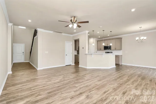 a view of a kitchen with a sink and a refrigerator