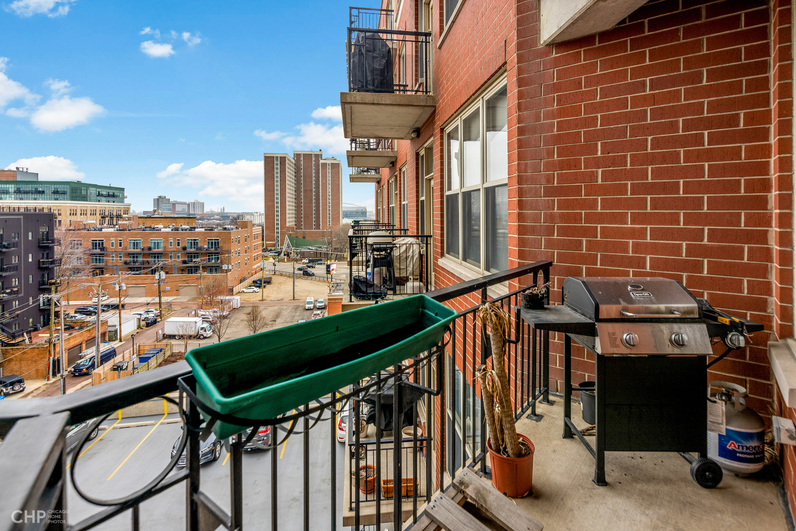 6 South Laflin Street, Unit 721 Chicago, IL 60607 - Photo 18 of 20 a view of an chairs and tables in the balcony