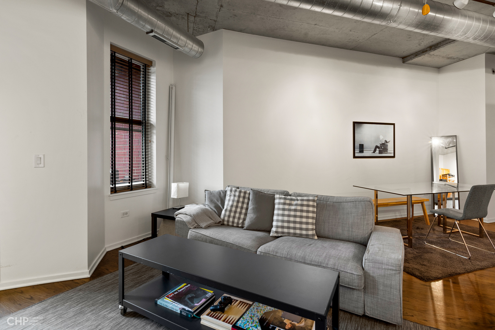 6 South Laflin Street, Unit 721 Chicago, IL 60607 - Photo 5 of 20 a living room with furniture and painting on the wall