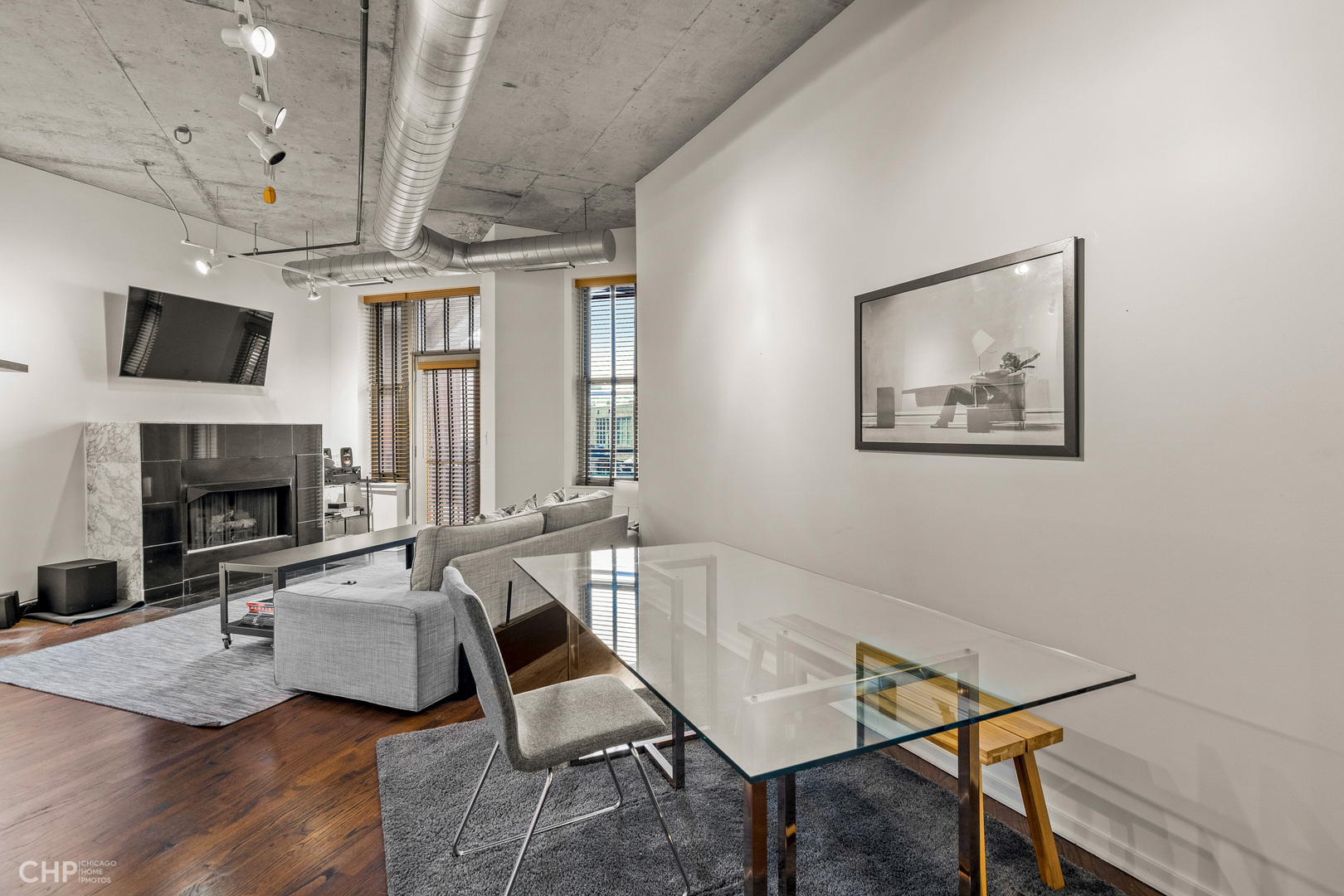 6 South Laflin Street, Unit 721 Chicago, IL 60607 - Photo 6 of 20 a workspace with furniture and a fireplace