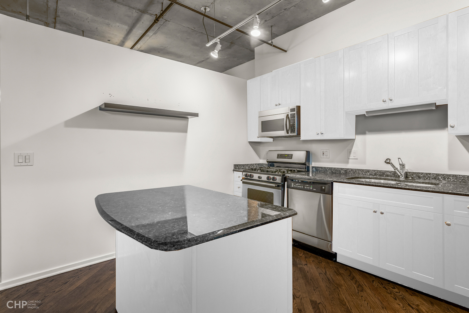6 South Laflin Street, Unit 721 Chicago, IL 60607 - Photo 10 of 20 a kitchen with granite countertop a stove and a sink