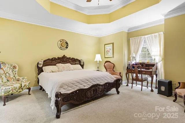 a bedroom with a bed and a table