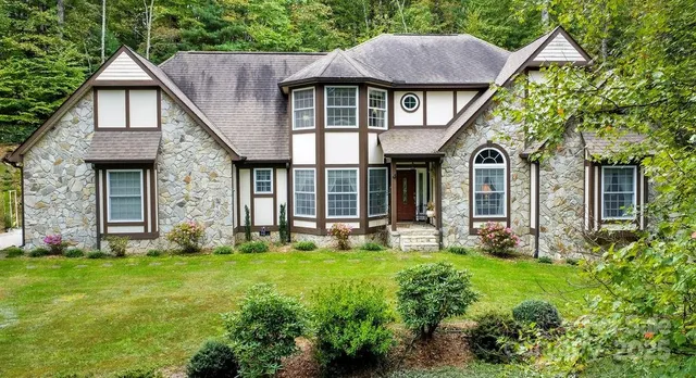 a view of a house with a flower garden