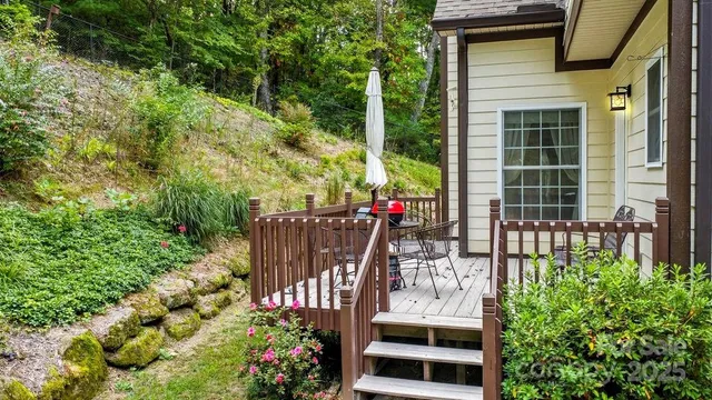 a yellow house with trees in front of it