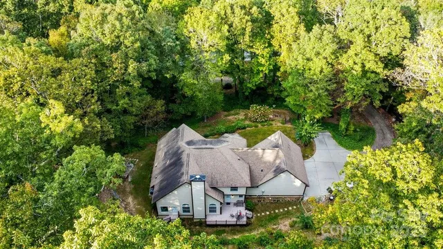 a view of a lush green hillside and a building