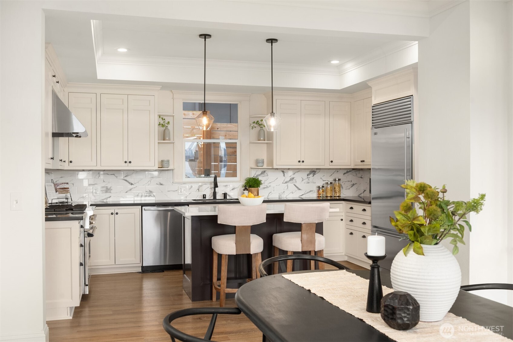 3807 East Jefferson Street Seattle, WA 98122 - Photo 16 of 39 a kitchen with stainless steel appliances granite countertop a sink a stove a refrigerator and cabinets