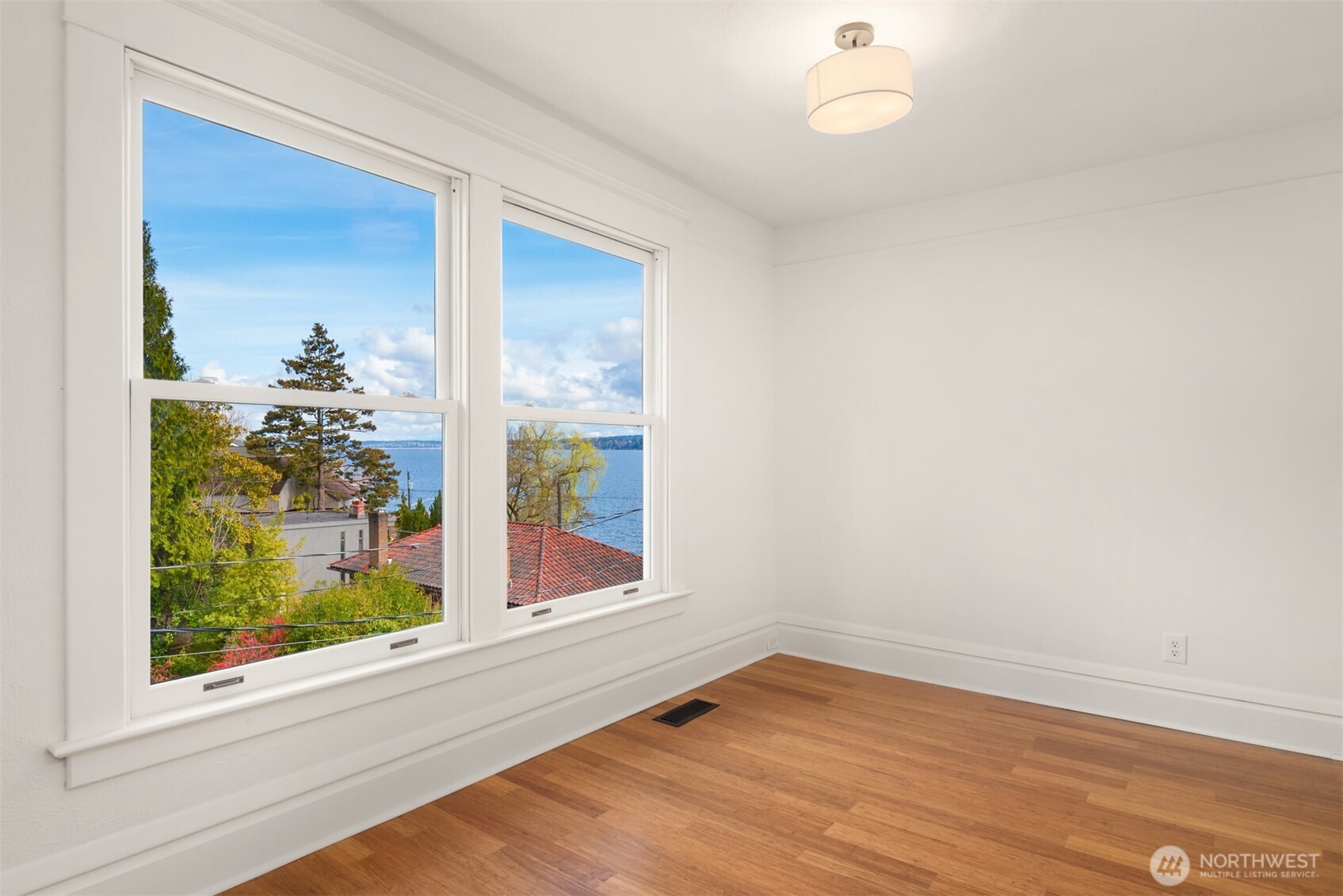 3807 East Jefferson Street Seattle, WA 98122 - Photo 30 of 39 a view of empty room with wooden floor and fan