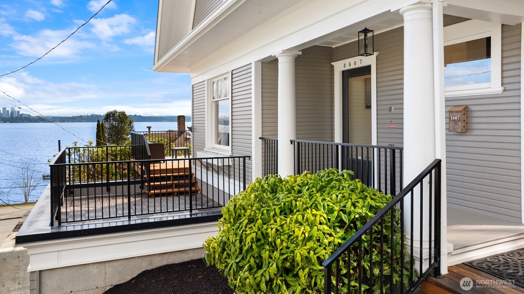 3807 East Jefferson Street Seattle, WA 98122 - Photo 5 of 39 a view of a balcony with a floor to ceiling window and wooden fence