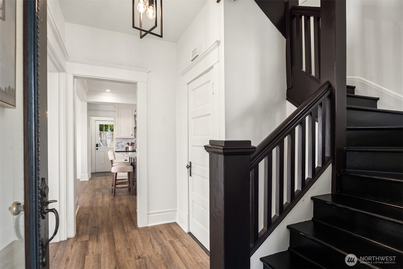 3807 East Jefferson Street Seattle, WA 98122 - Photo 7 of 39 a view of hallway with stairs and wooden floor